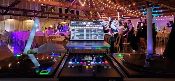 Professional DJ and sound system set up for a corporate event