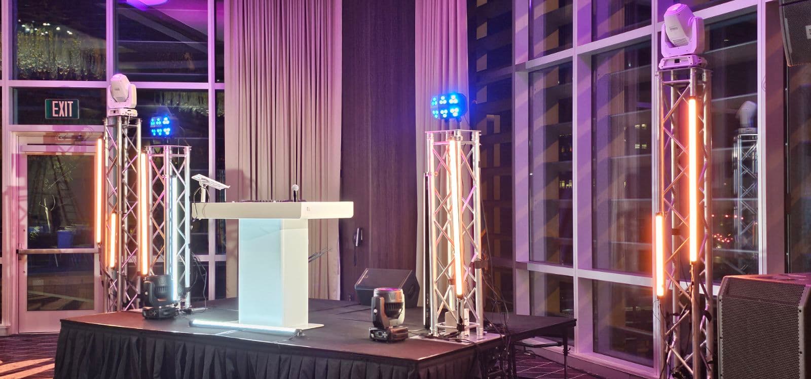 Professional DJ equipment and speakers set up for a wedding reception